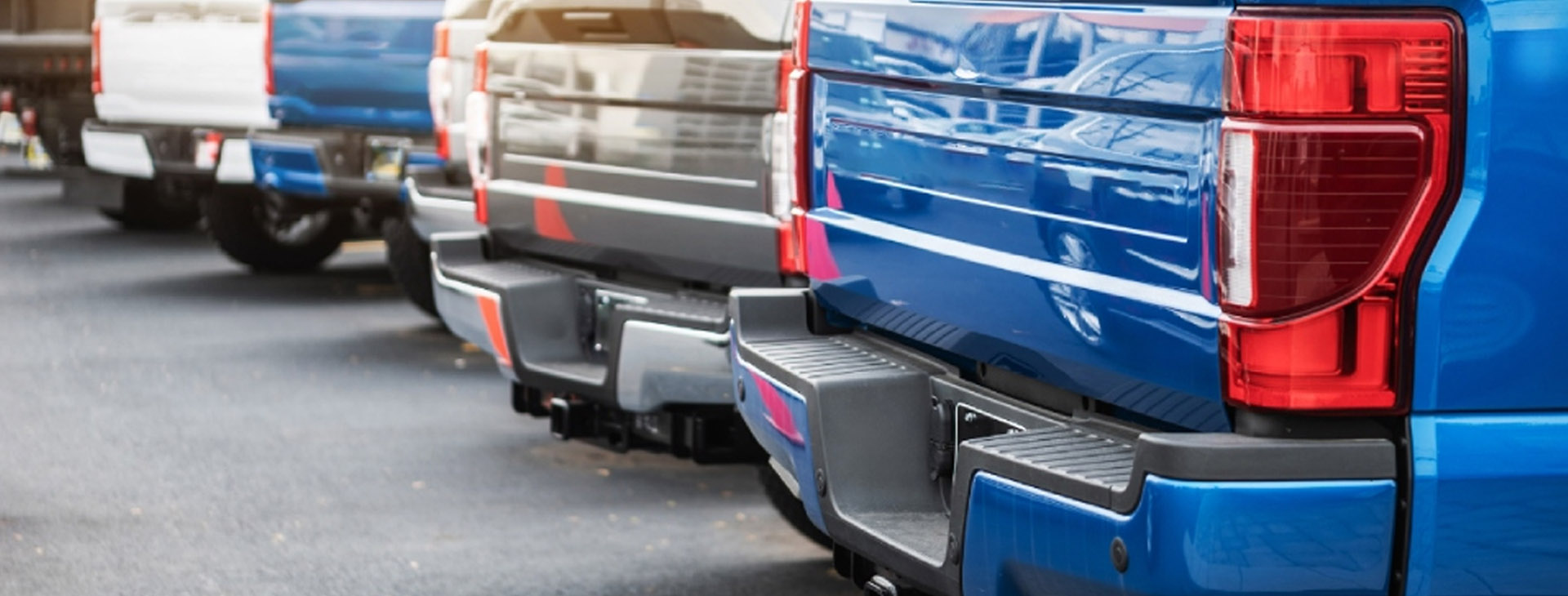 Elevare Insurance Agency commercial auto insurance header image showing fleet of business vehicles representing commercial vehicle coverage.